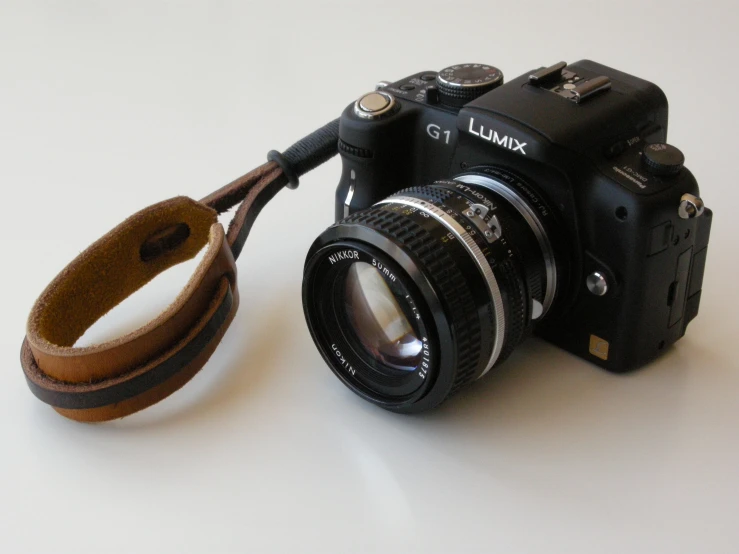 a camera sitting on top of a white table