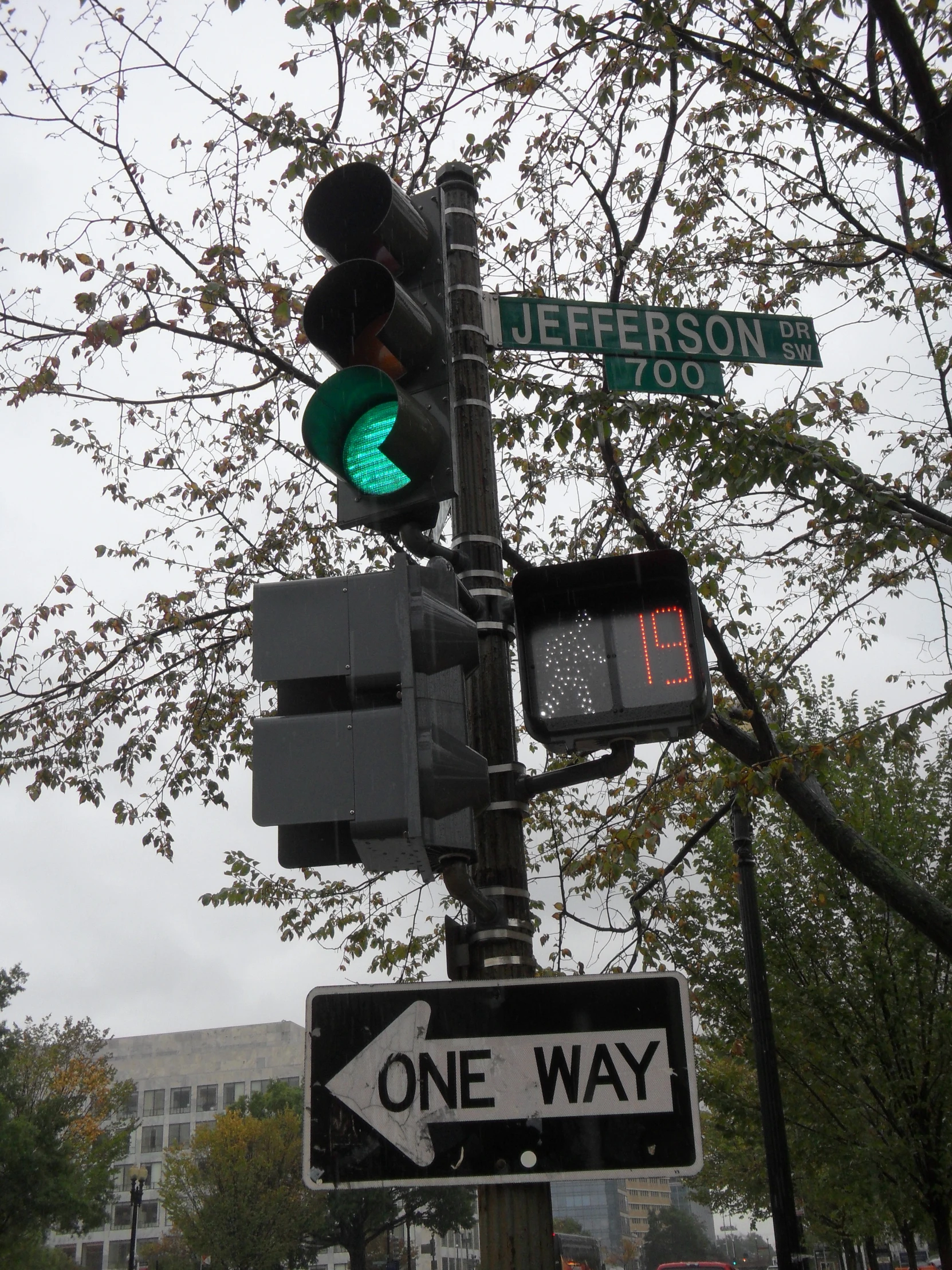 there are many street lights on this corner