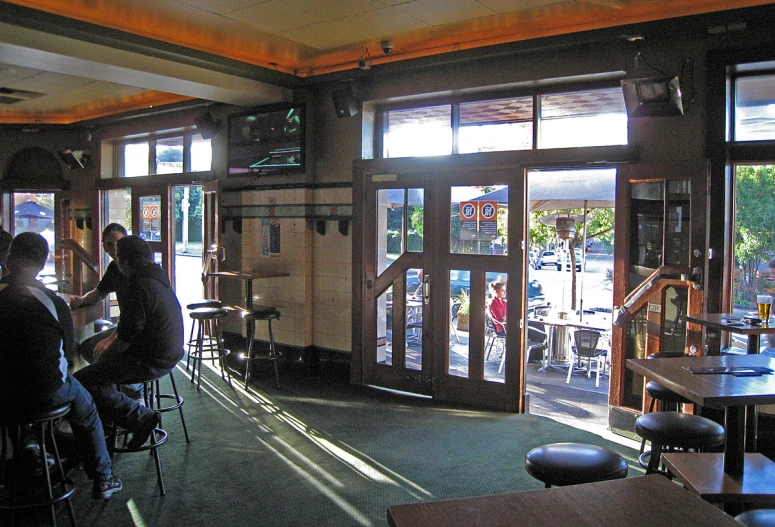 a view of people sitting at tables and walking around