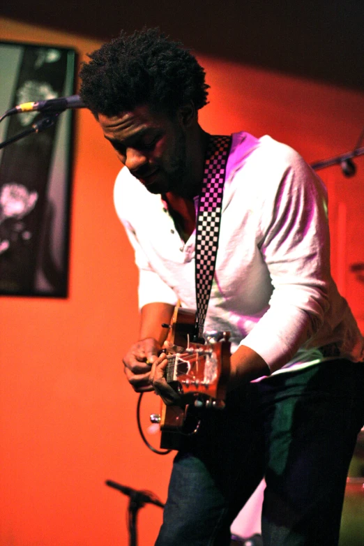 a man playing the guitar at an event