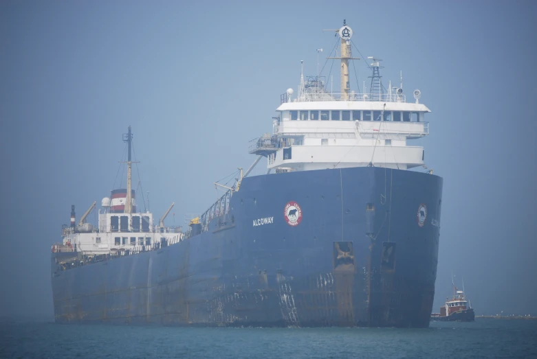 a large, blue and white ship on water