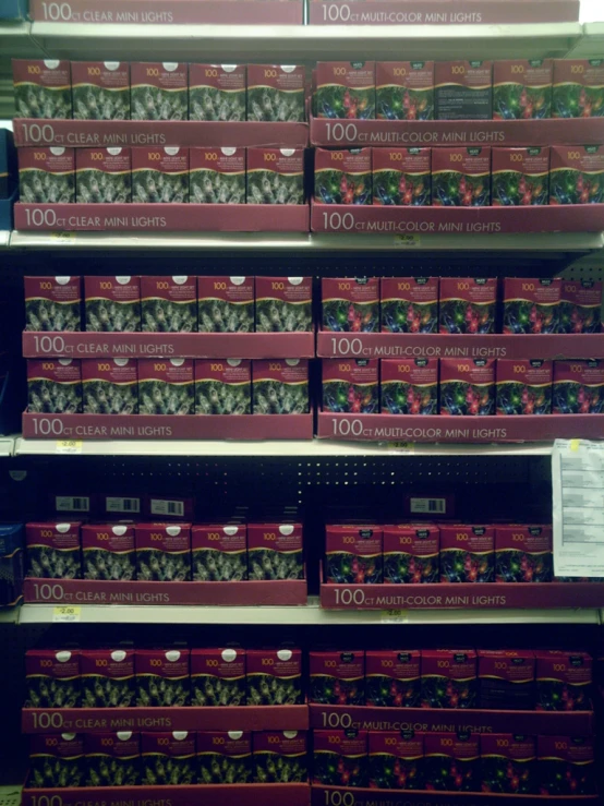 the shelves have red boxes with a variety of objects