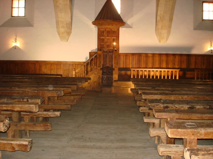 a building with several benches and an old clock