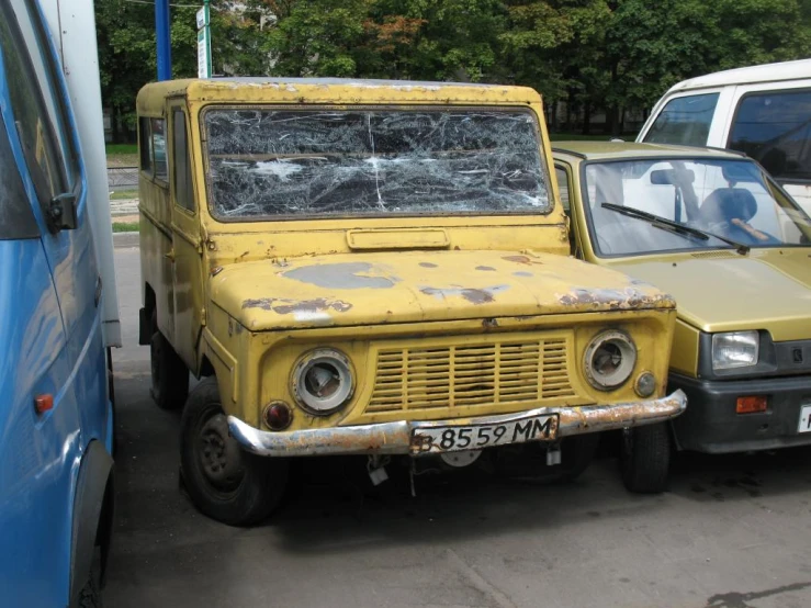 the truck is parked next to other vehicles