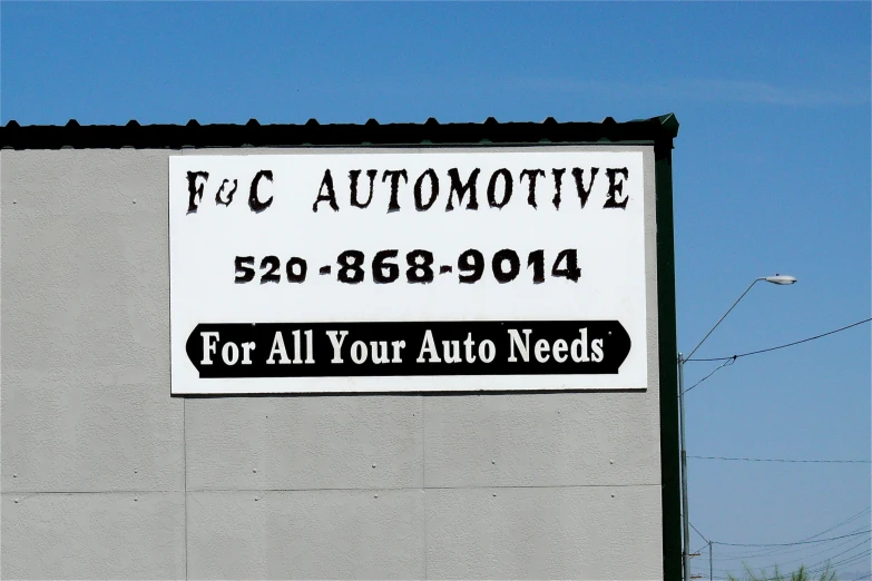 an advertising for a new car is shown on the wall of a building