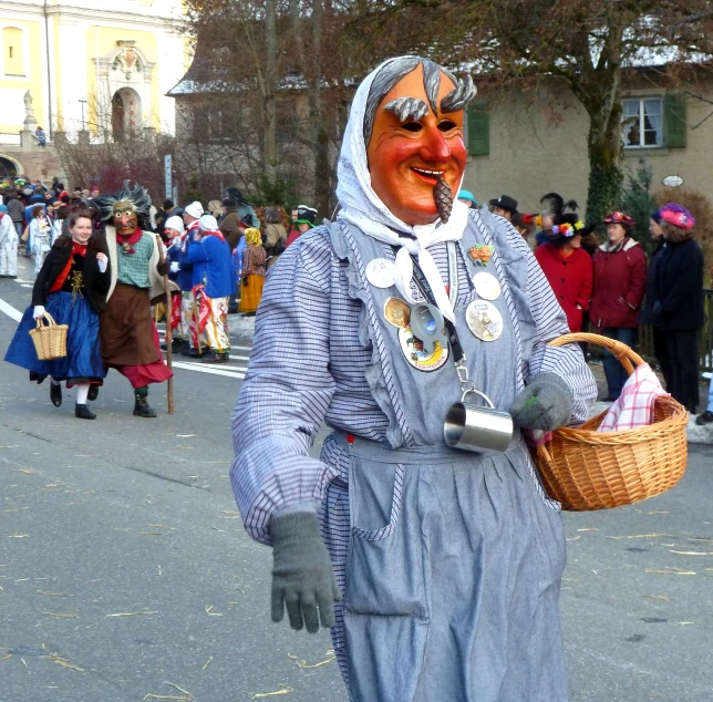 a man in costume is holding a basket