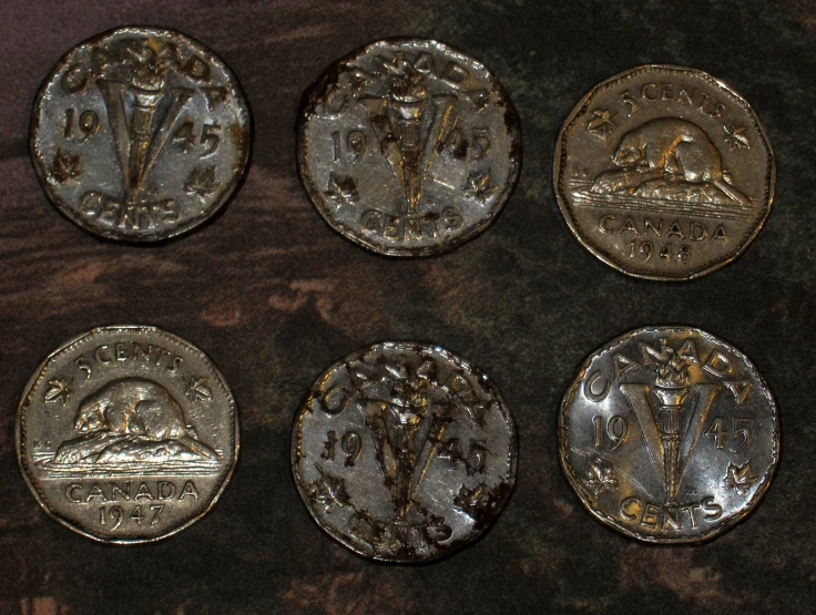 nine different metal discs that look to have various emblems