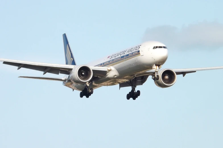 an air plane with three engines landing