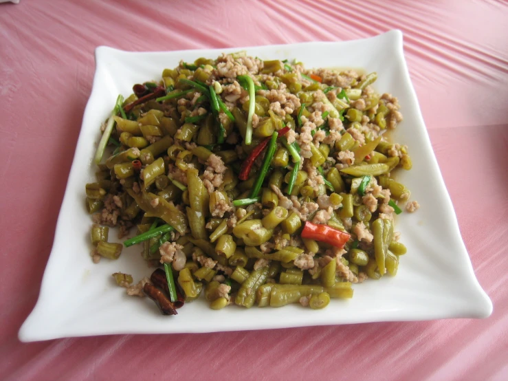 a plate topped with a pasta dish filled with meat