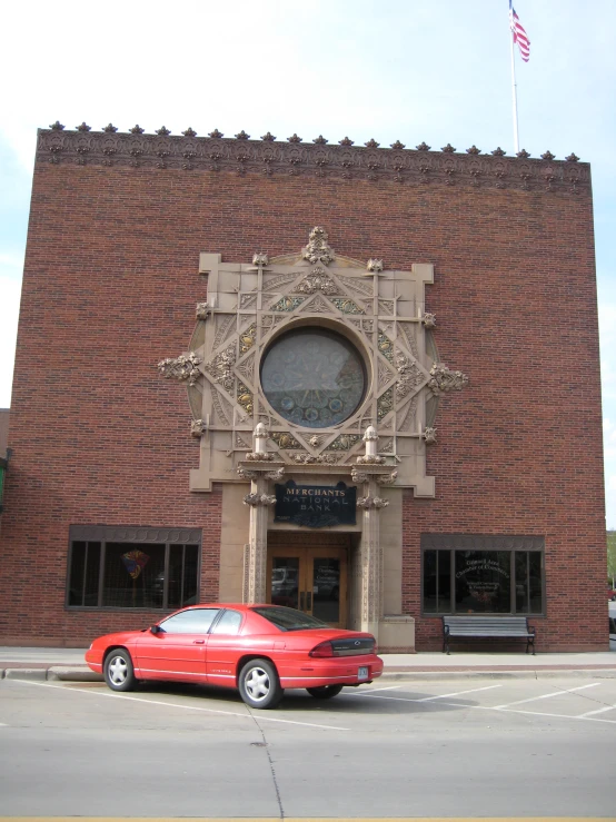 a car parked outside of an old building