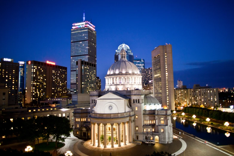 a large building with a dome on top is lit up