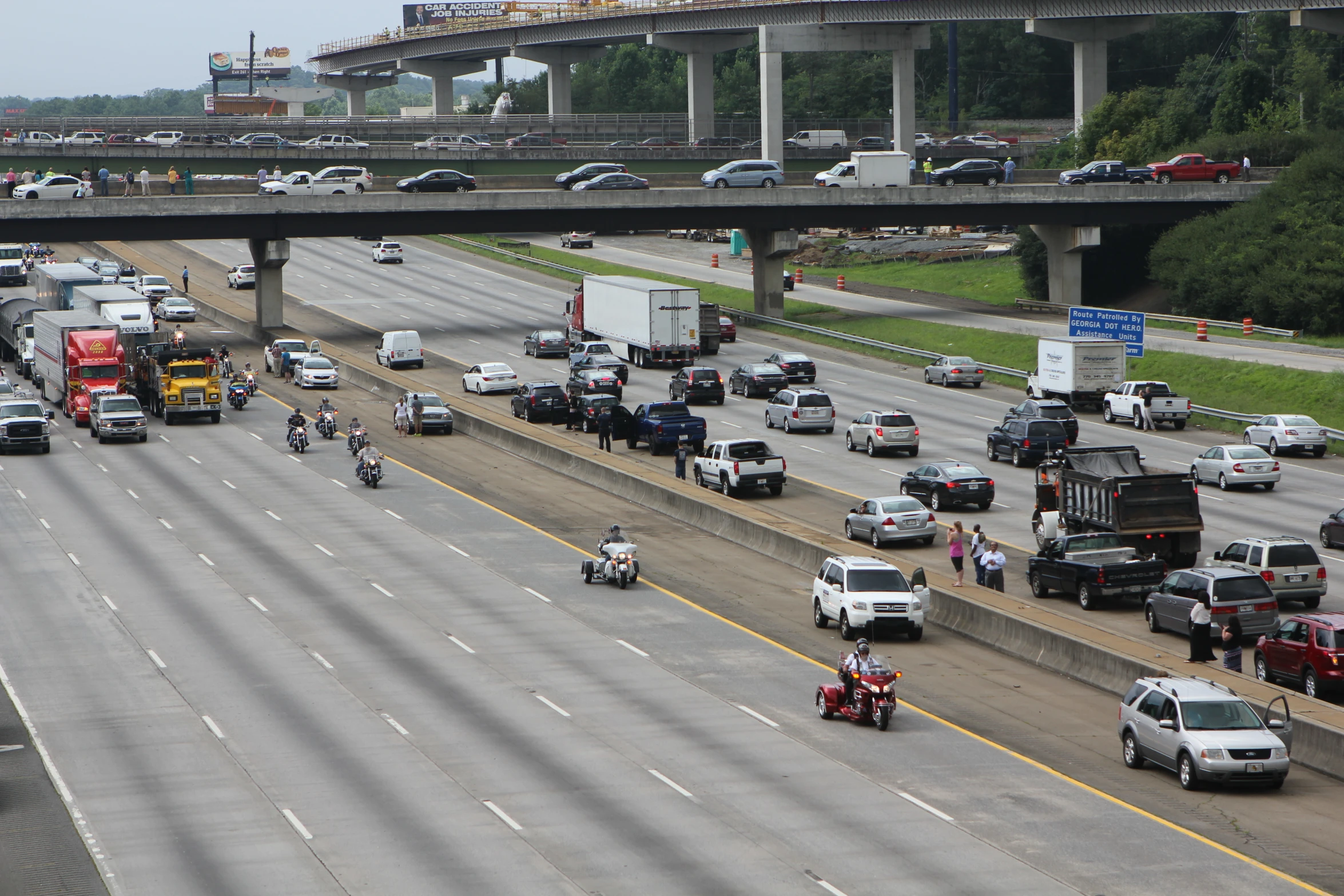 a long line of cars and trucks on a highway