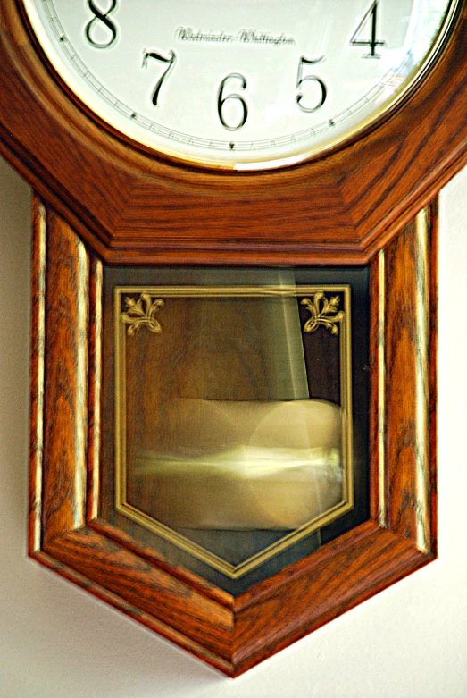 an image of a clock hanging on the wall