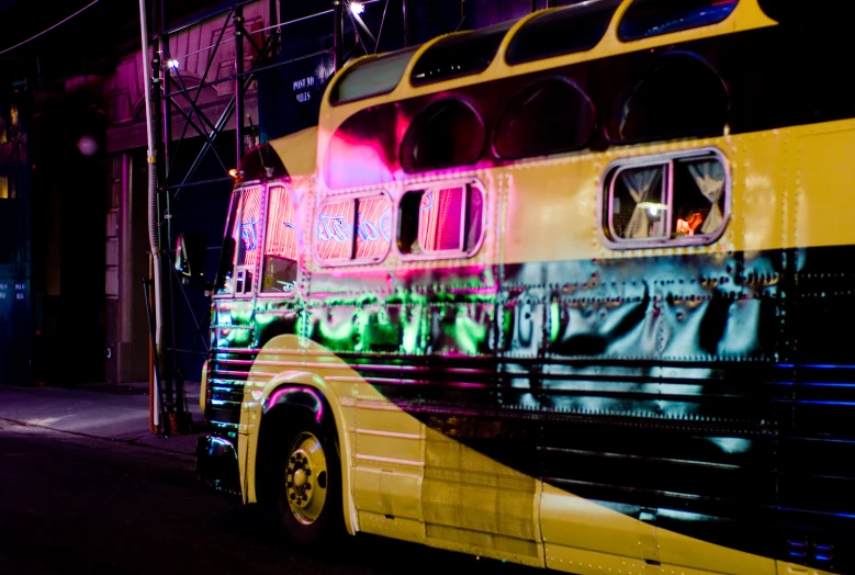 a double decker bus with graffiti on the side of it