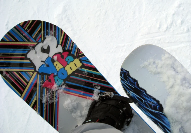 the bottom of a snowboard is up in the air