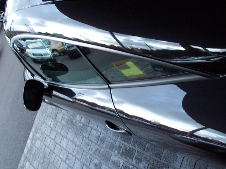 view from inside the car to street with cars parked in street