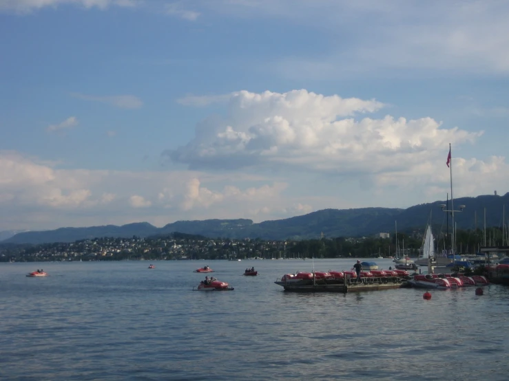 several boats in the water on a sunny day