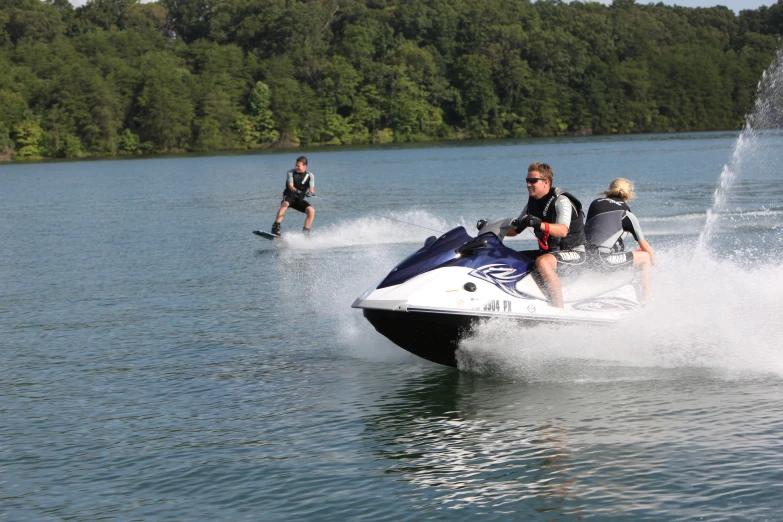 the people are on jet skis in the water