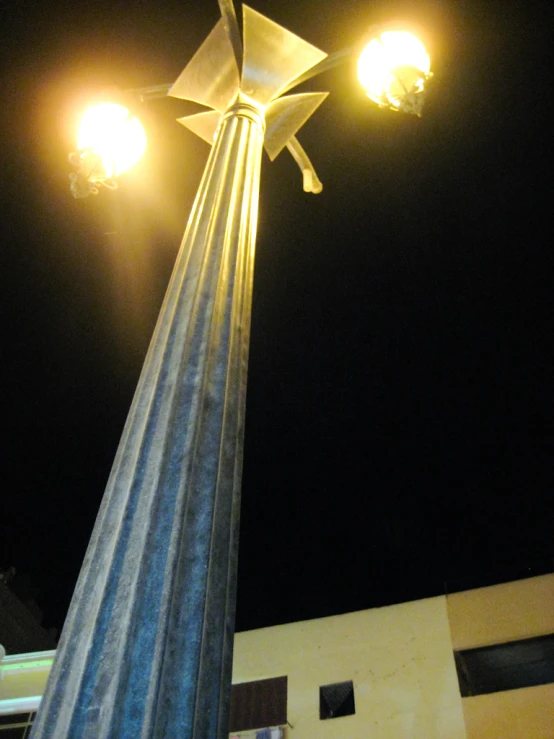 a street light on a pole near a building