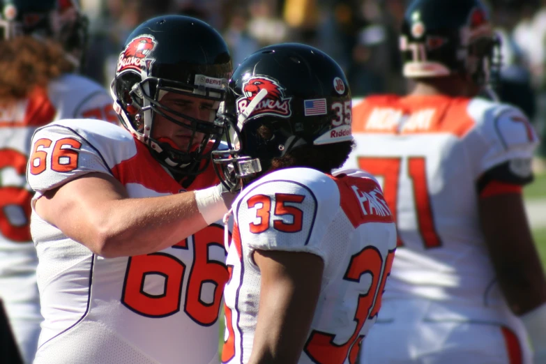 some football players are standing on the field