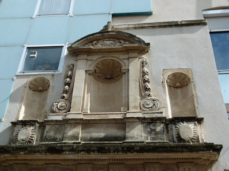 an old building that has a small window on it