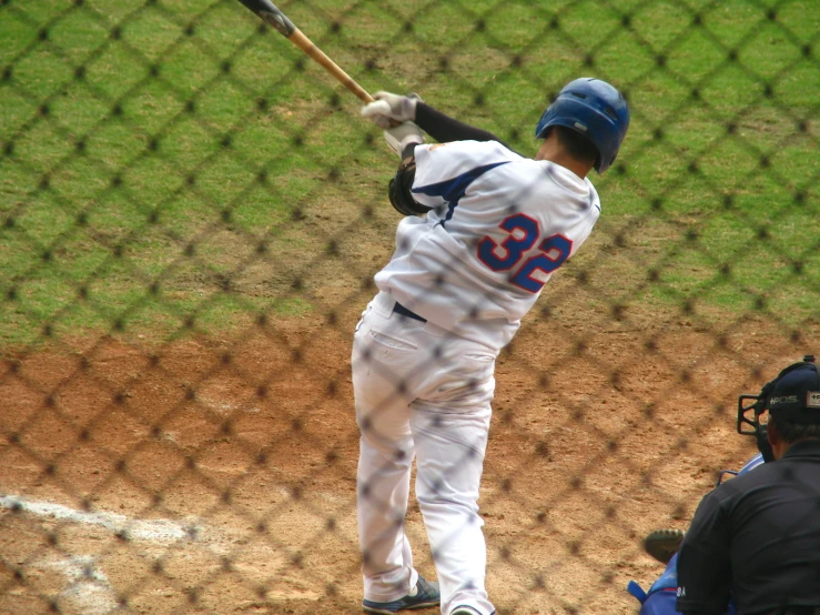 a baseball player swinging the bat during a game