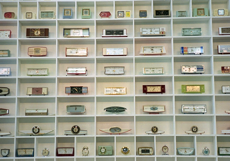 a book case with a wide wall of open shelves