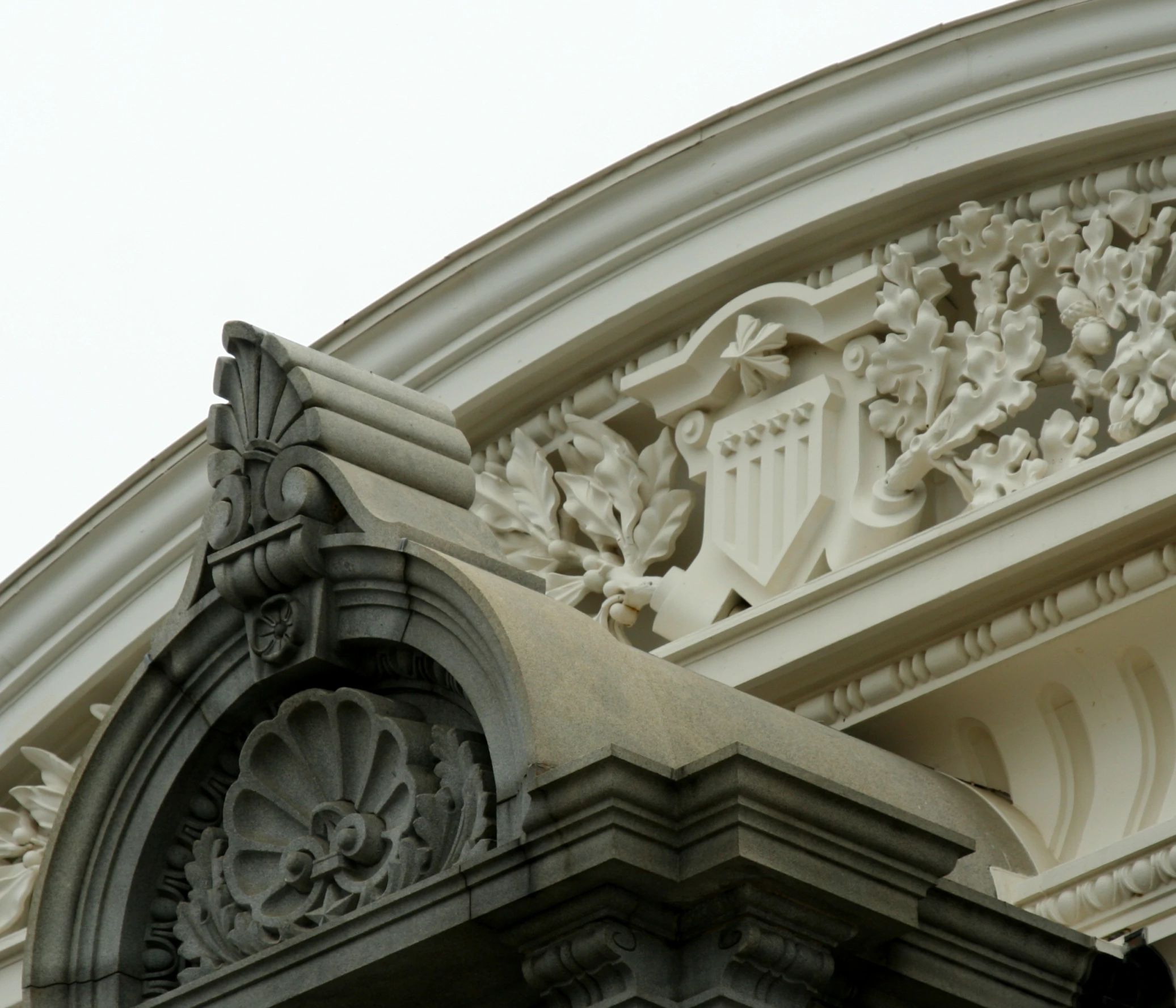 an ornately decorated building with stucco, carvings and leaves