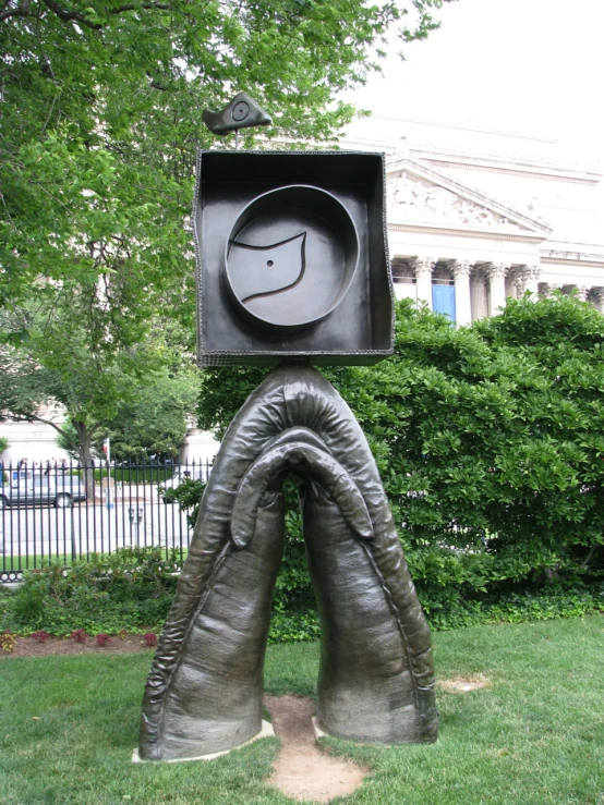 the sculpture depicts an elephant coming out of the mouth with an umbrella