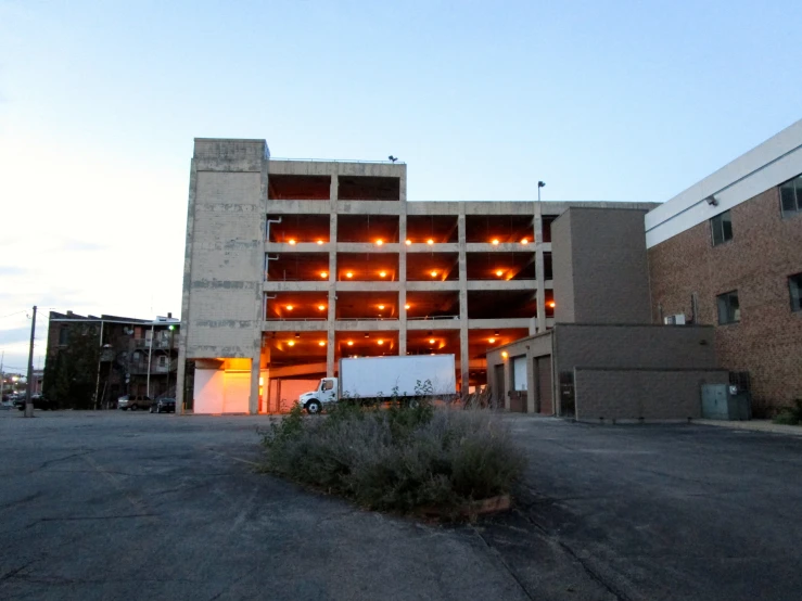 a large industrial building has lots of windows