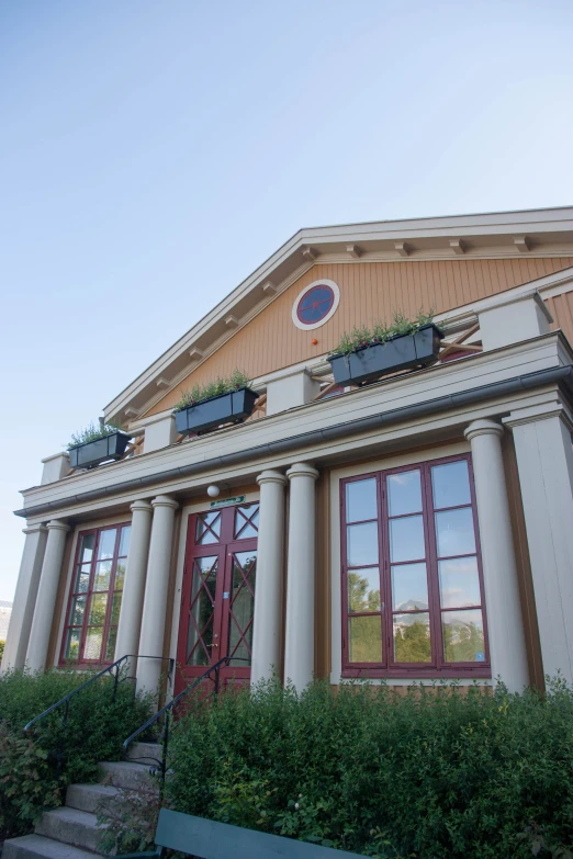 the front of the building with the clock above it