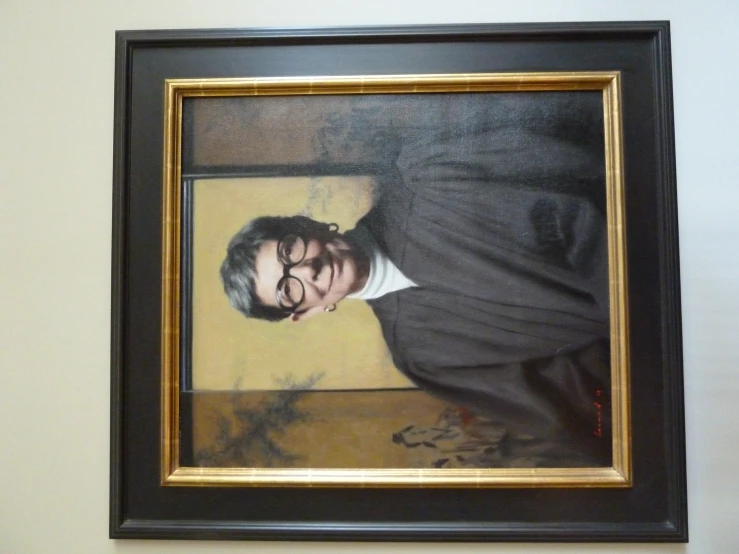 a portrait of a priest hangs on a wall