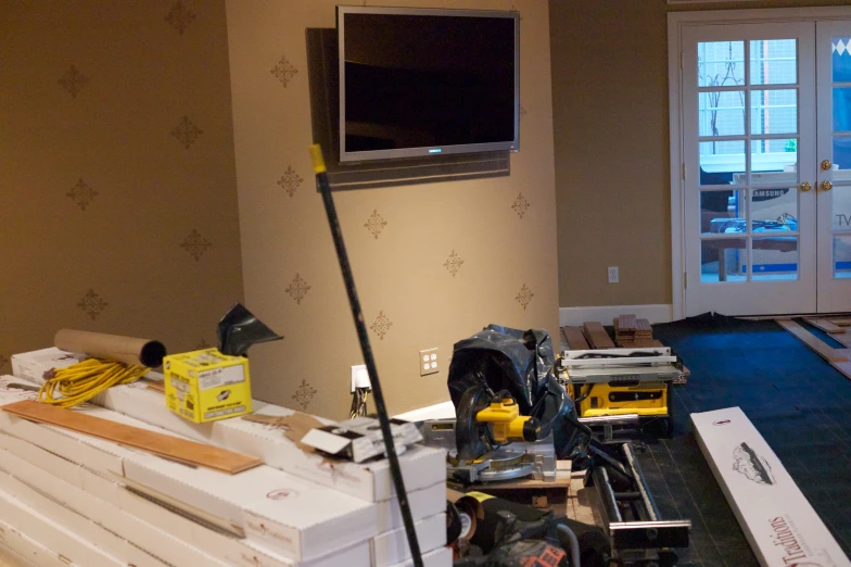 a room with multiple construction tools and an electronic device