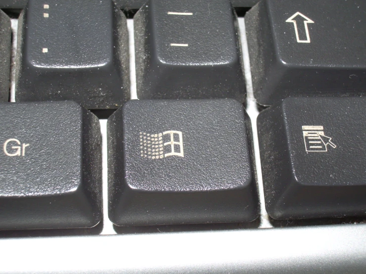 a computer keyboard with the key and a symbol painted on