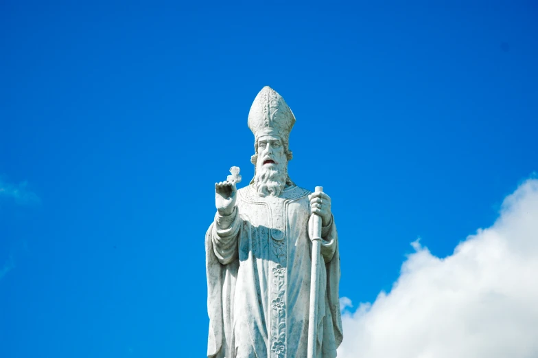 a statue of a man on a sunny day