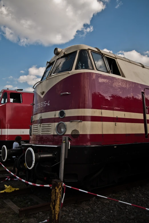 a train sitting on top of train tracks next to another train