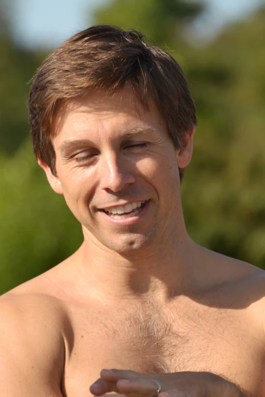 a man holding up a white frisbee in his right hand