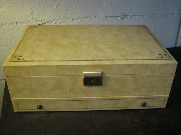 a leather box sitting on top of a table