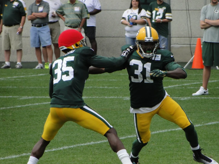 two football players with different jerseys on each team