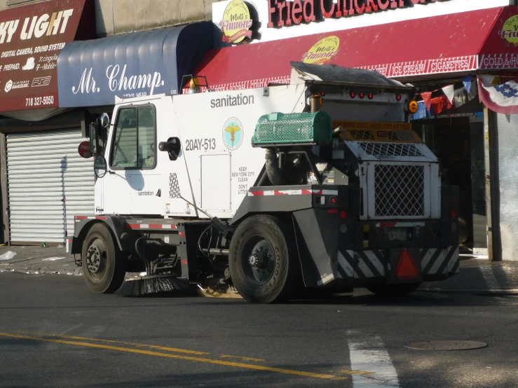 a large truck drives down a city street