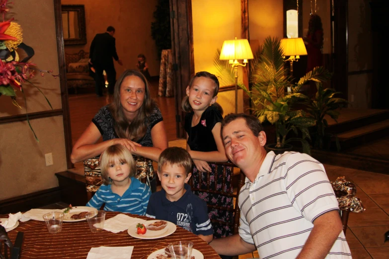 a family gathered at a restaurant for dinner