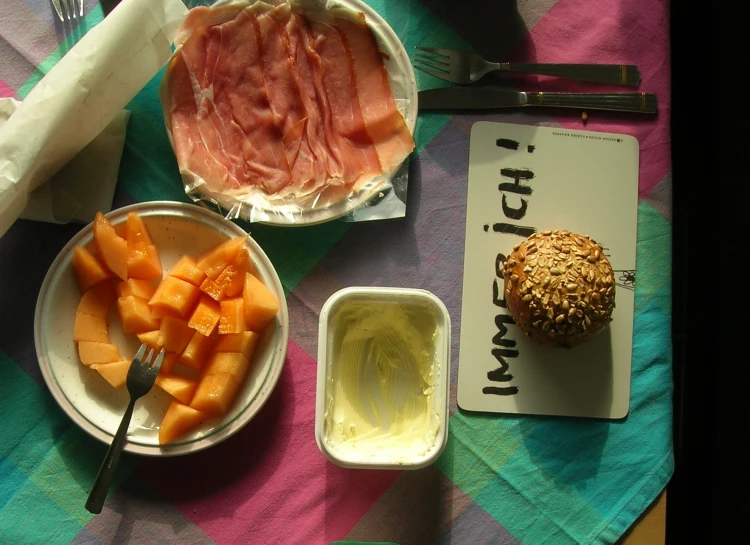 a table set with plates of food and drinks