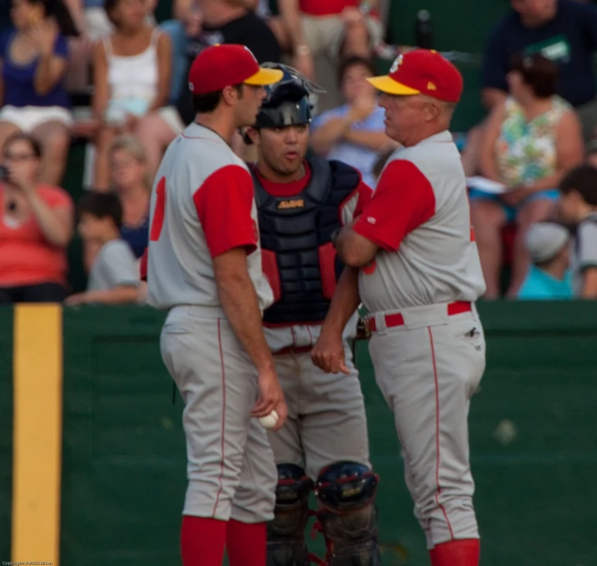 a group of baseball players talking to each other