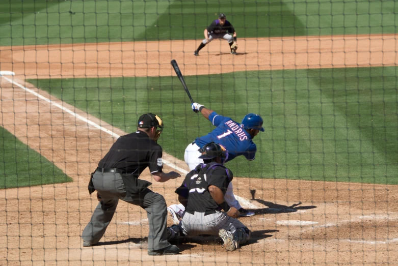 a baseball game is in progress as the batter prepares to hit the ball