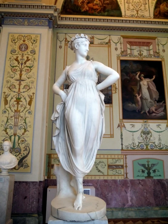 statue, painted in neoclassical colors, with ornate designs