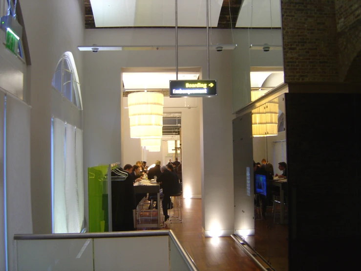 a restaurant in a building with people on their laptops