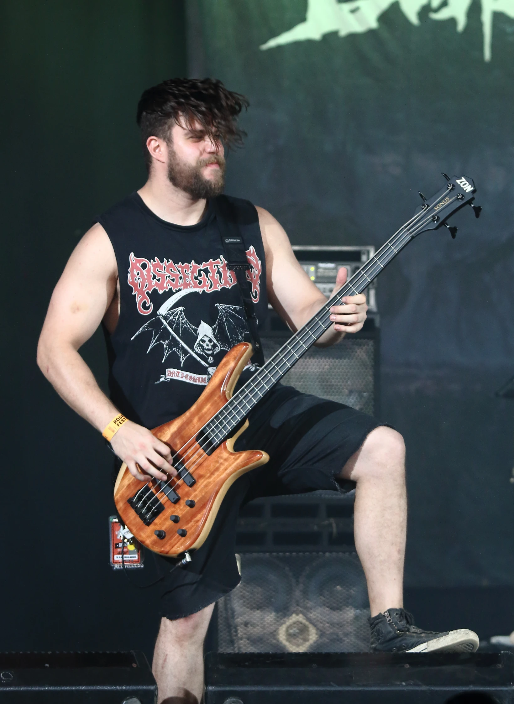 guy with dreadlocks on holding a bass guitar