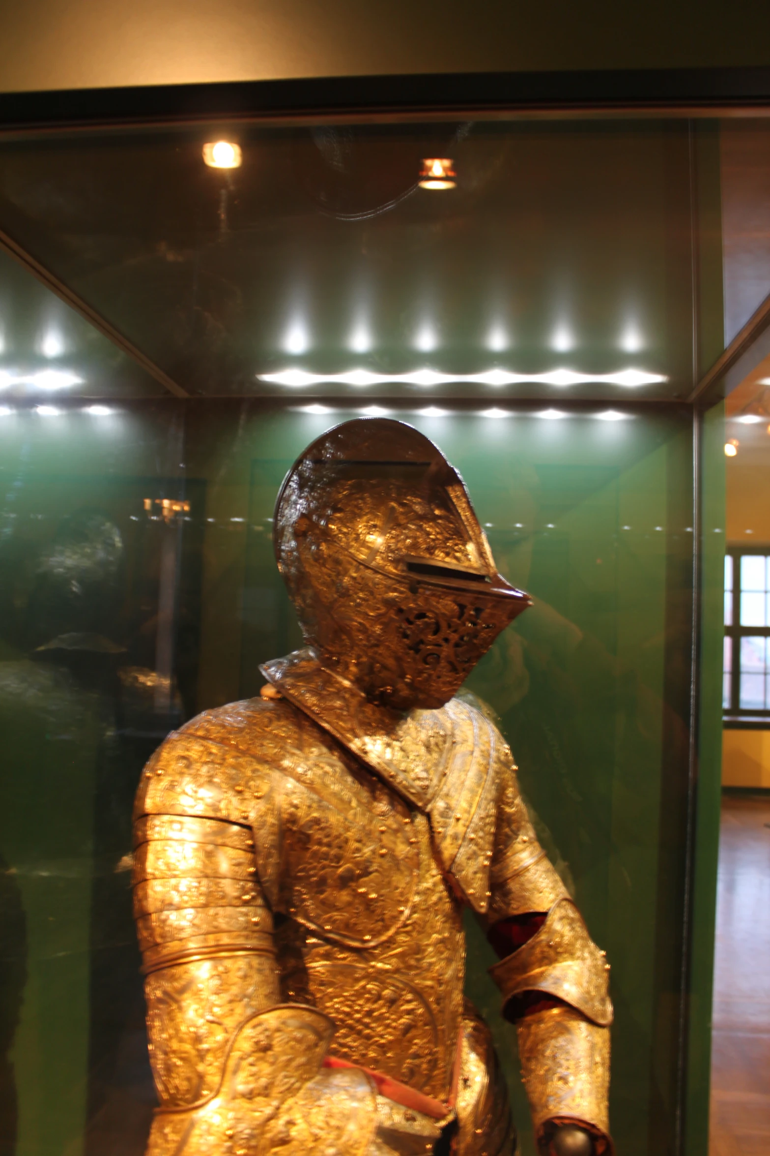 a gold statue sitting in a display case