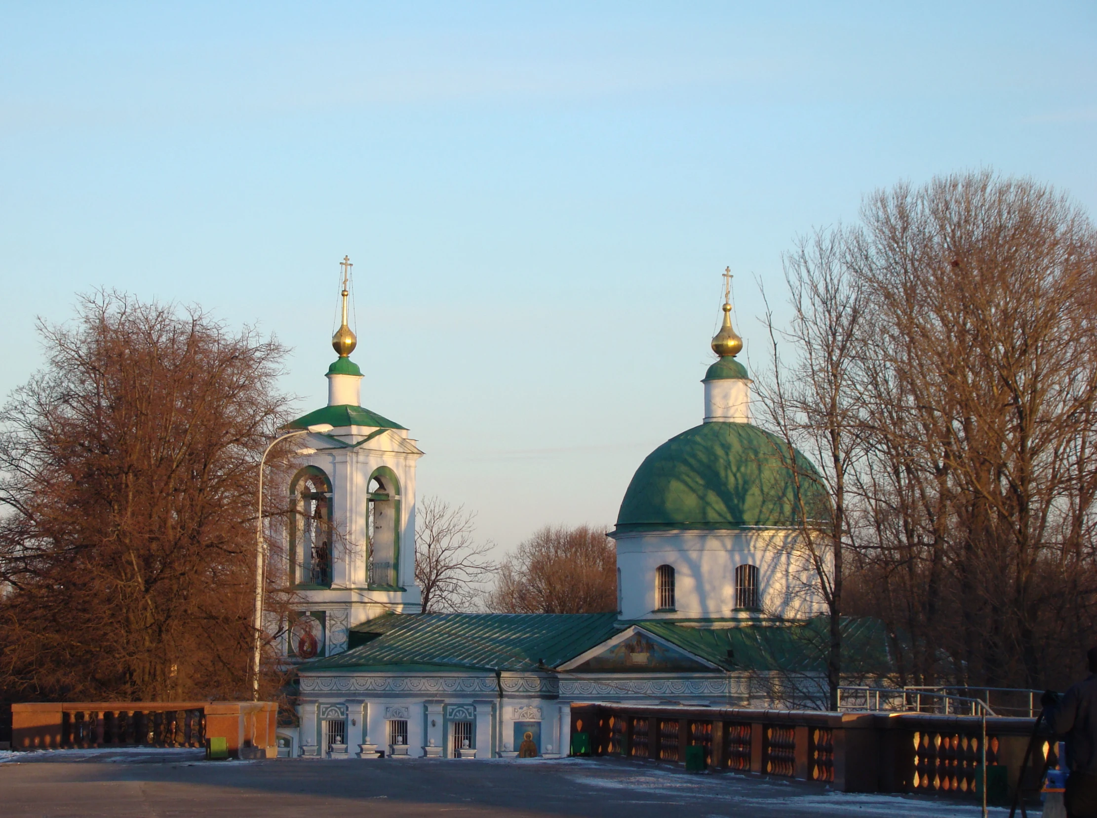 two green and white domed domes on a church