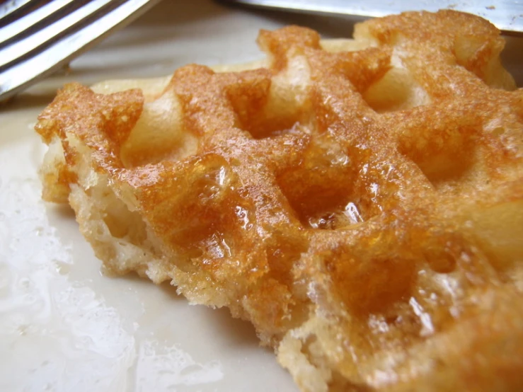 closeup of an empty waffle on a plate with forks